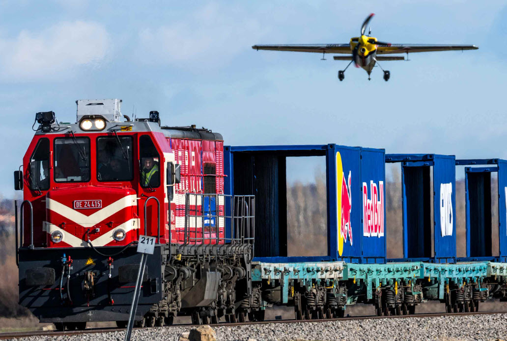 Pilot Lands and Takes Off from Moving Train